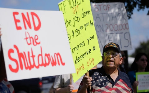 Veteran Raul Sanchez protests for federal workers idled by the government shutdown in San Antonio, Texas.