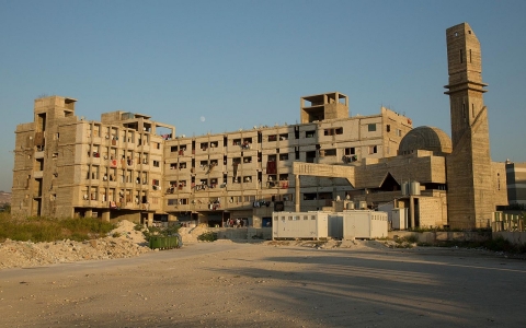 At one point, this complex was meant to be part of a university for Islamic studies. Now it's home to more than 850 Syrian refugees, most from the same village.