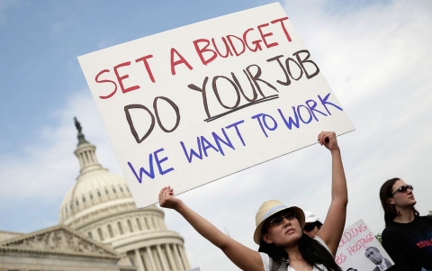 Woman protests government shutdown