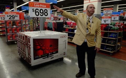 Manager Eric Quist leads visitors on a tour as Walmart prepares to open one of its' new stores on Dec. 3, 2013 in Washington, D.C. 