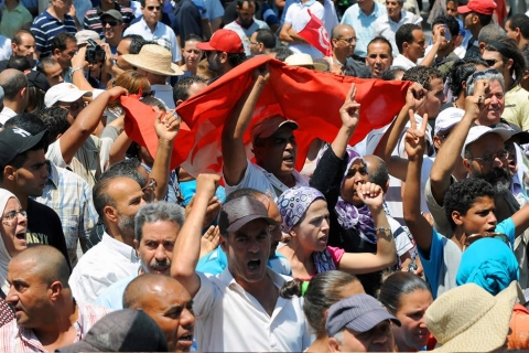 Protests broke out after opposition leader Mohamed Brahmi was shot 14 times and killed on Thursday. (Fethi Belaid/AFP/Getty images)