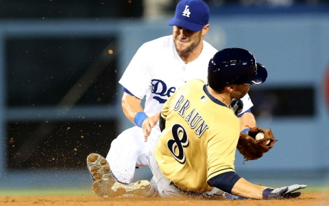 Skip Schumaker of the Los Angeles Dodgers tags out Milwaukee's Ryan Braun trying to steal second base at Dodger Stadium on April 27 in Los Angeles.