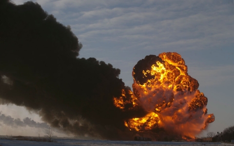 A fire breaks out at the site of an oil train derailment in Casselton, N.D. on Dec. 30, 2013. 