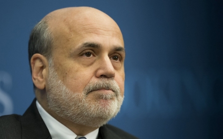 In Bernanke's final act, Fed cuts stimulus despite market turmoil