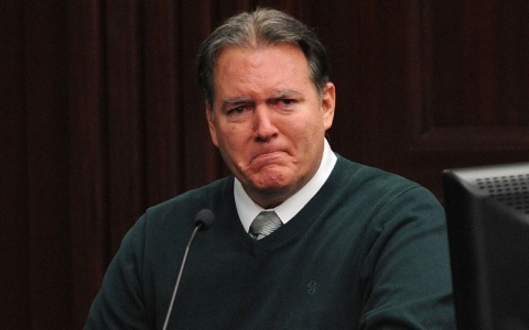 Defendant Michael Dunn reacts on the stand during testimony in his own defense during his murder trial in Duval County Courthouse in Jacksonville, Florida.