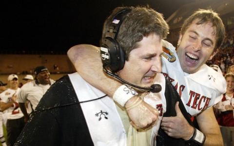 Before he turned to coaching, Kingsbury, right, was the starting quarterback at Texas Tech under Mike Leach, pictured here after winning the Tangerine Bowl in 2002.