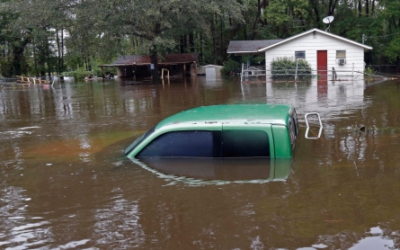 'Fire hose' of rain in Carolinas leaves at least 12 dead