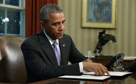 Obama signs defense bill despite Guantanamo provisions