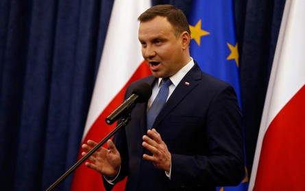 Polish president signs controversial court reforms into law