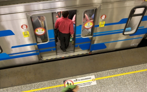 Passenger boards Metro in Santiago