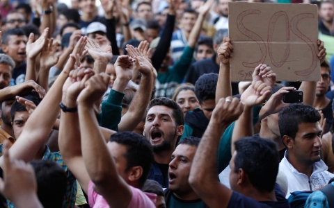 Thumbnail image for Refugees blocked from boarding trains protest at Budapest station