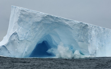 Massive breaking icebergs unexpectedly slow global warming, scientists say