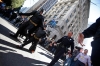 Batkid returns to the Batmobile.