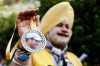 A cricket fan showing a medal with a portrait of Tendulkar outside a stadium in Mumbai.