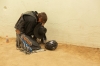 Bull rider Dakota Louis says a prayer before mounting his championship ride. 