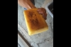 Ralph Gaeta, holding a block of beeswax created from his hives in Astoria, Queens. 