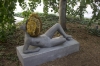 A recent MOMA exhibit by artist Pierre Huyghe called Untilled (Liegender Frauenakt), shows a reclining stone figure with an active beehive on its head.  